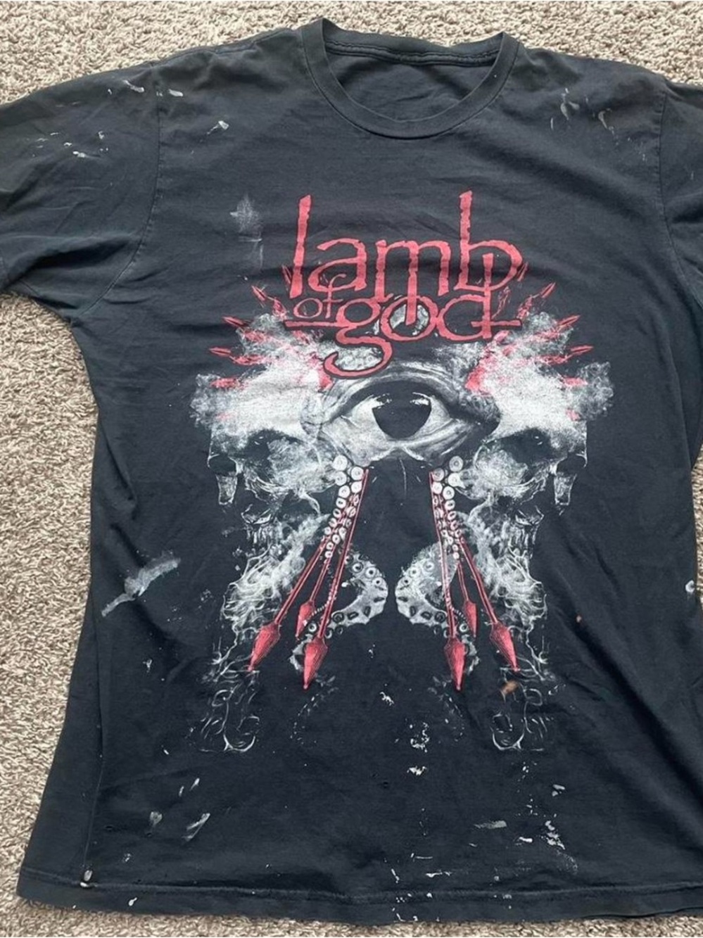 Very thrashed Lamb of God band shirt.